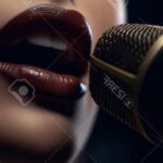 208814502 concert show karaoke or performance concept close up of female musician mouth singing song into 2